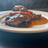 image of a piece of Jerk Chicken